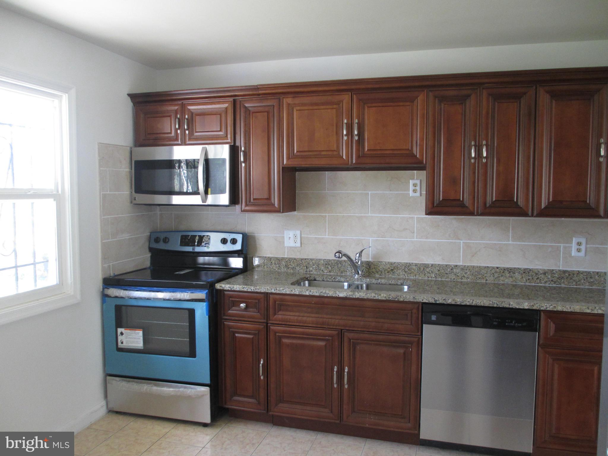 9317 Avenel Road Silver Spring, MD 20903 - Photo 4 of 26 New cabinet, granite top, new ss appliances