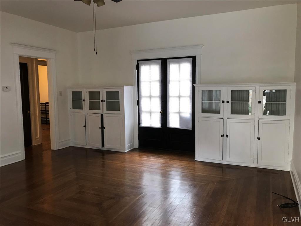 2122 Walnut Street, Unit D Allentown, PA 18104 - Photo 3 of 11 an empty room with wooden floor and windows