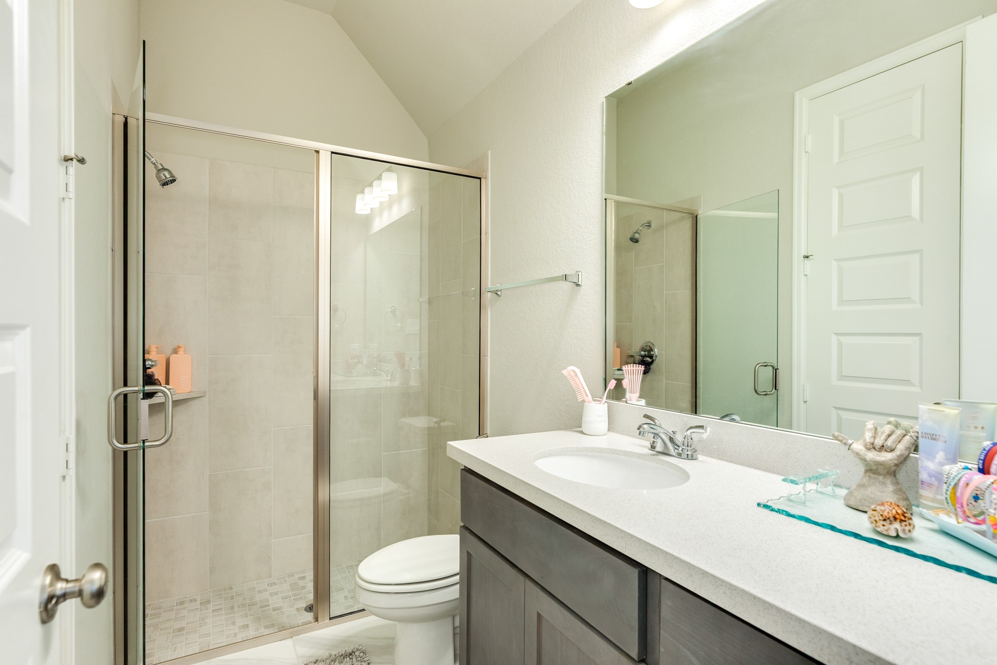 5138 Walnut Grv Lane Manvel, TX 77578 - Photo 28 of 43 a bathroom with a granite countertop sink toilet and shower