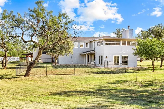 a view of a swimming pool with an outdoor space