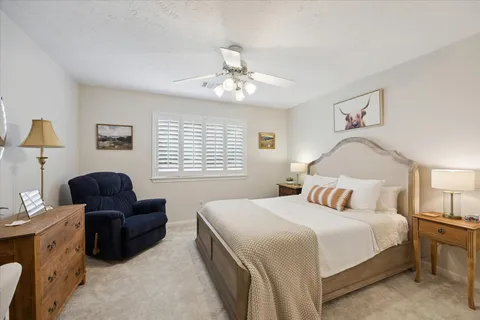 a bedroom with a bed and a couch