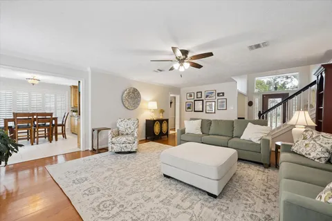 a living room with furniture a fireplace and a table