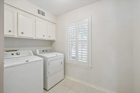 a view of storage and utility room with washer and dryer