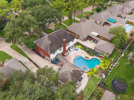 an aerial view of house with yard