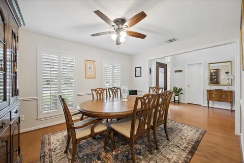 a dining room with furniture and window
