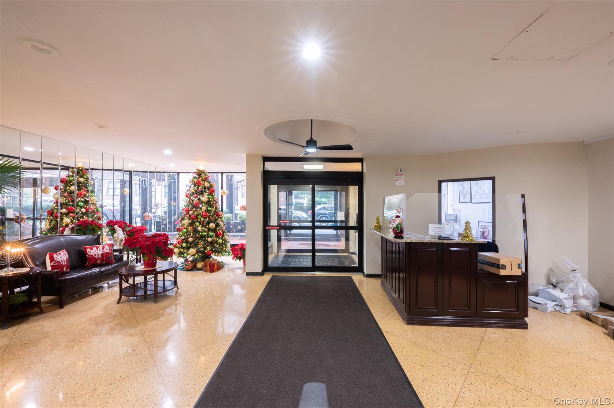 35-20 Leverich Street, Unit 209 Queens, NY 11372 - Photo 12 of 12 a living room with furniture toys and a chandelier