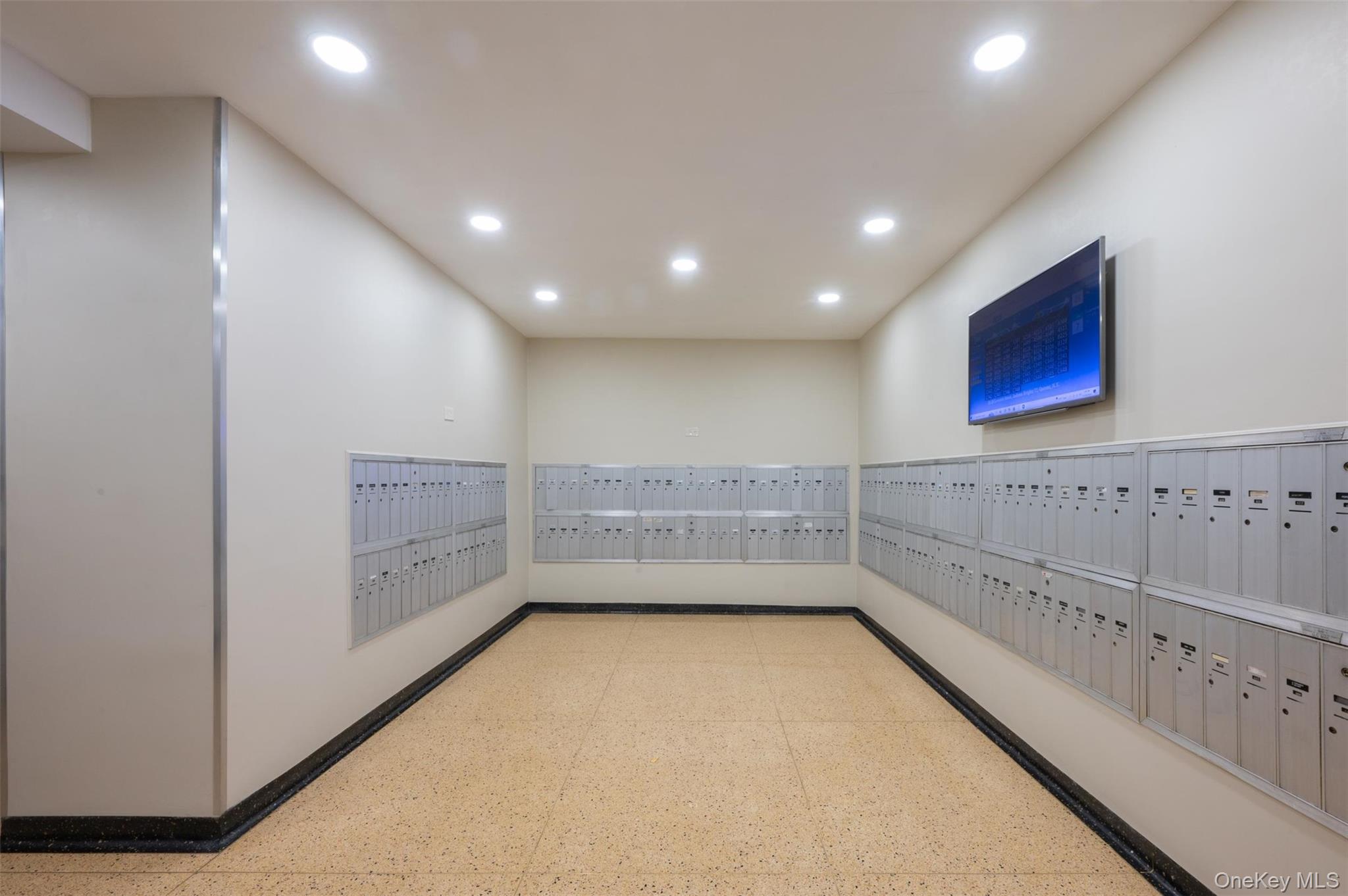 35-20 Leverich Street, Unit 209 Queens, NY 11372 - Photo 10 of 12 a view of a hallway with wooden shelves