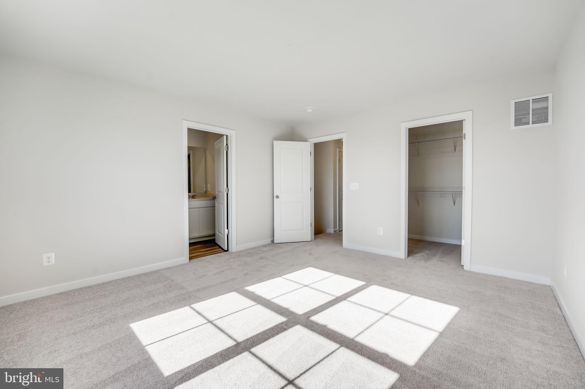 19122 Isabel Boulevard Appomattox, VA 24522 - Photo 29 of 35 an empty room with windows and closet