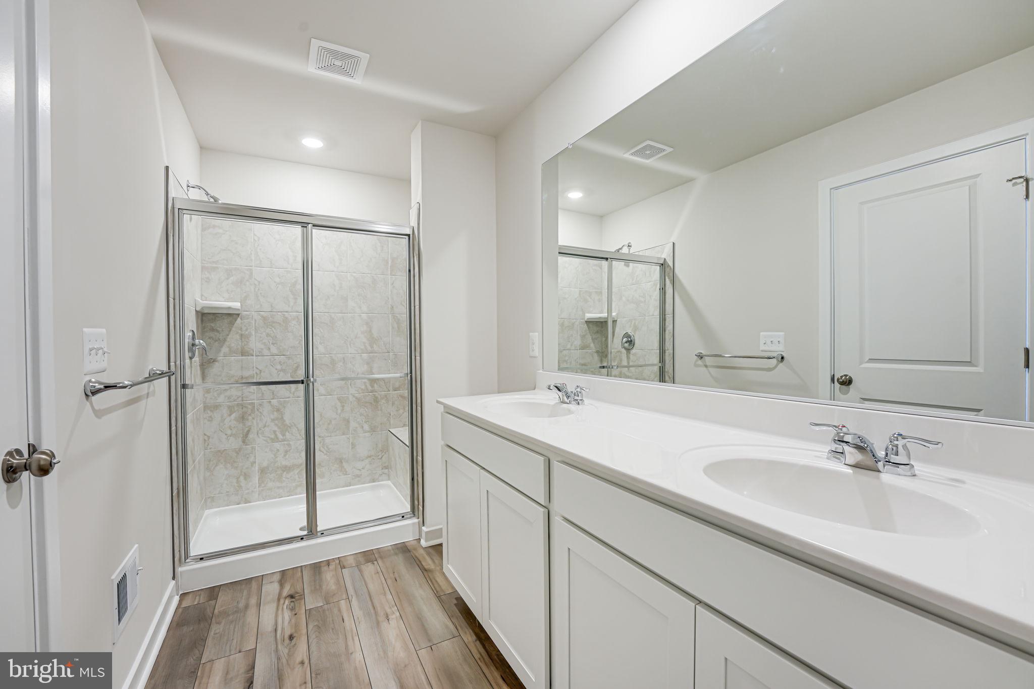 19122 Isabel Boulevard Appomattox, VA 24522 - Photo 31 of 35 a bathroom with a sink and a mirror