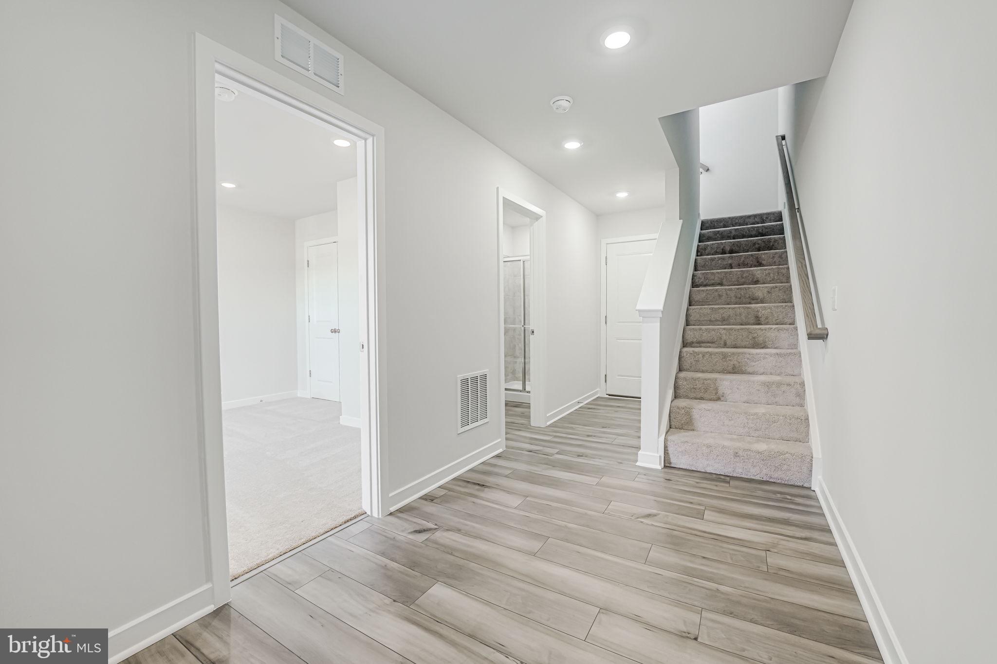 19122 Isabel Boulevard Appomattox, VA 24522 - Photo 4 of 35 wooden floor in an empty room with wooden floor