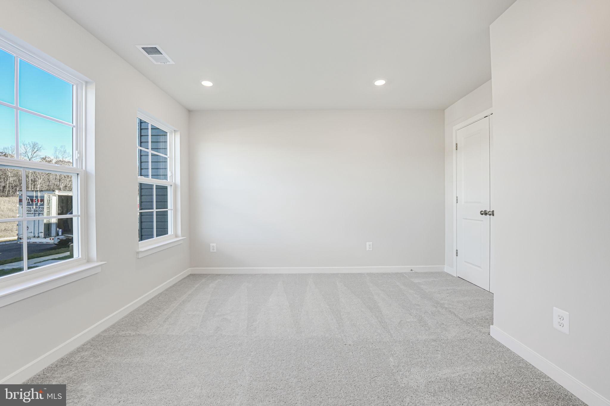 19122 Isabel Boulevard Appomattox, VA 24522 - Photo 5 of 35 an empty room with windows