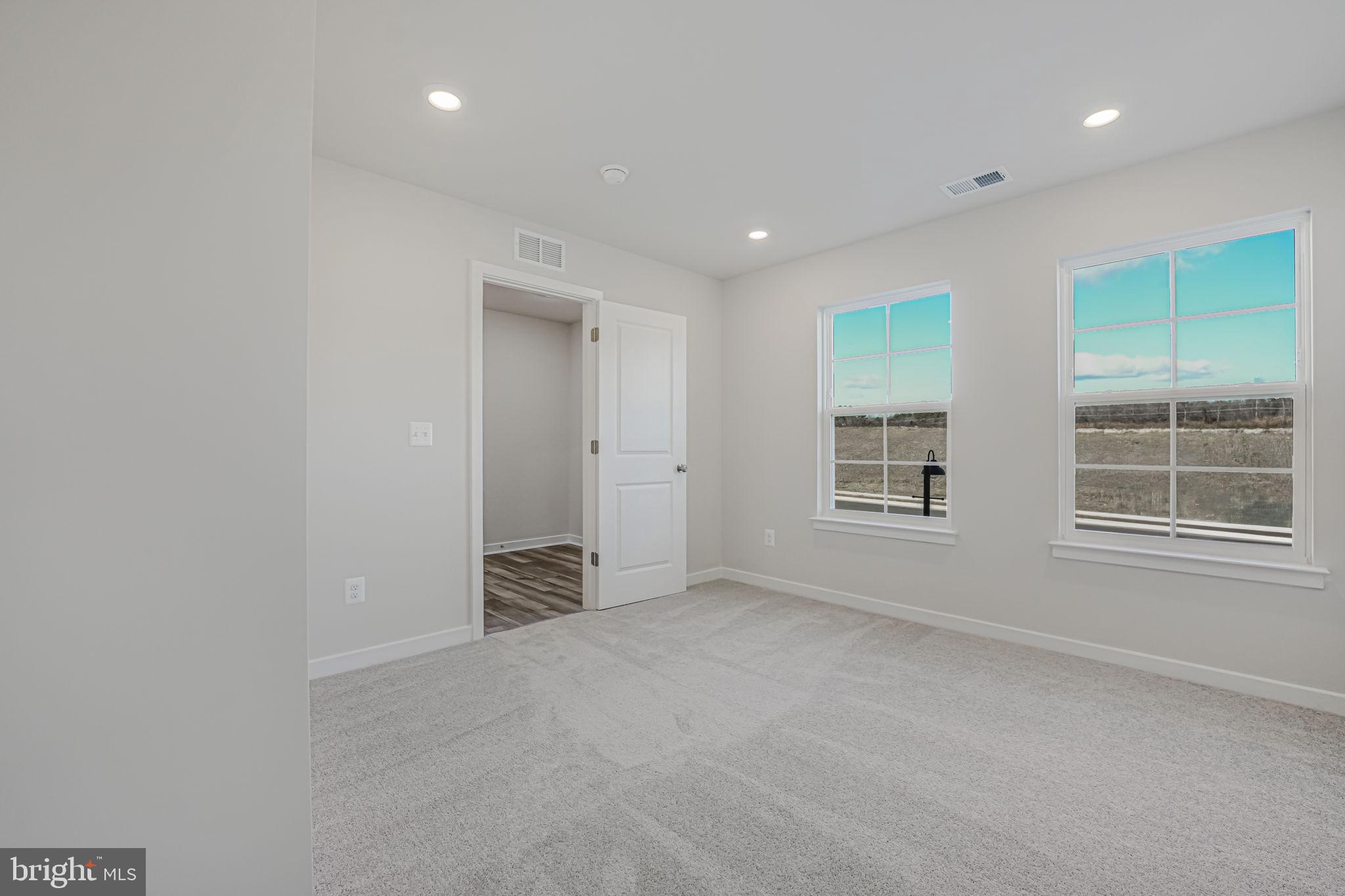 19122 Isabel Boulevard Appomattox, VA 24522 - Photo 6 of 35 an empty room with windows