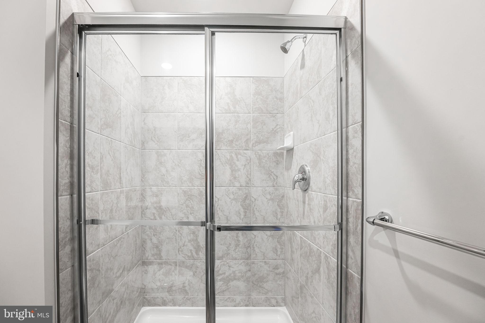 19122 Isabel Boulevard Appomattox, VA 24522 - Photo 8 of 35 a bathroom with a glass shower door