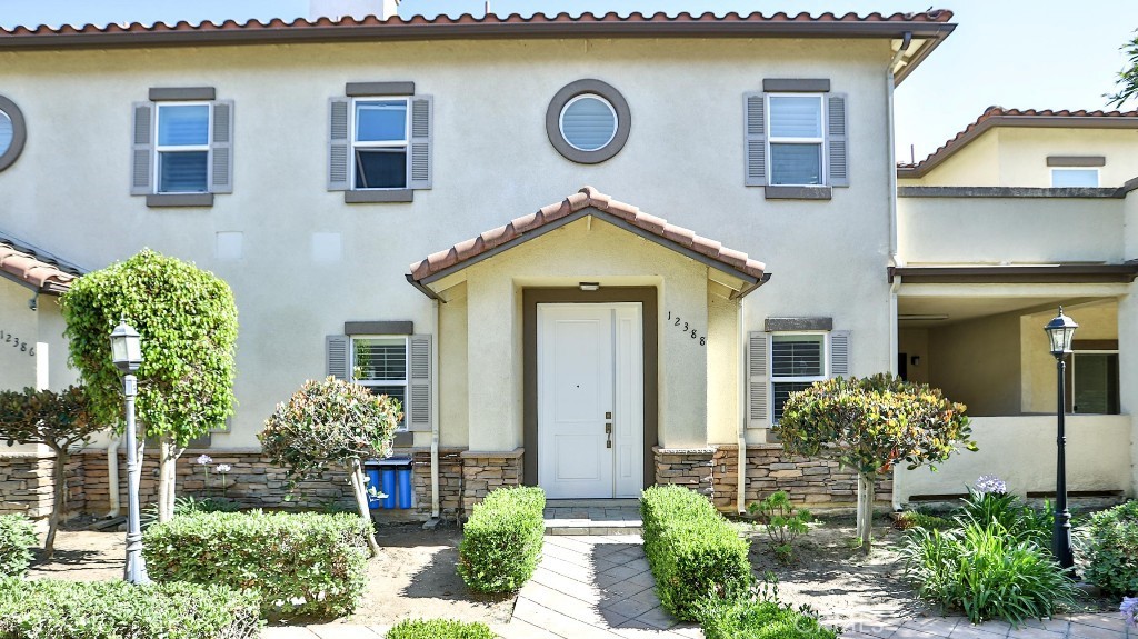 12388 Arrowhead Street Stanton, CA 90680 - Photo 1 of 69 a front view of a house with a yard