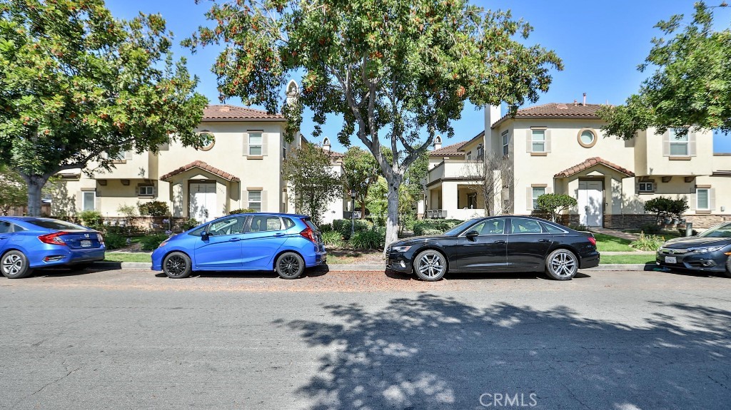 12388 Arrowhead Street Stanton, CA 90680 - Photo 2 of 69 a view of a cars parked in front of a house