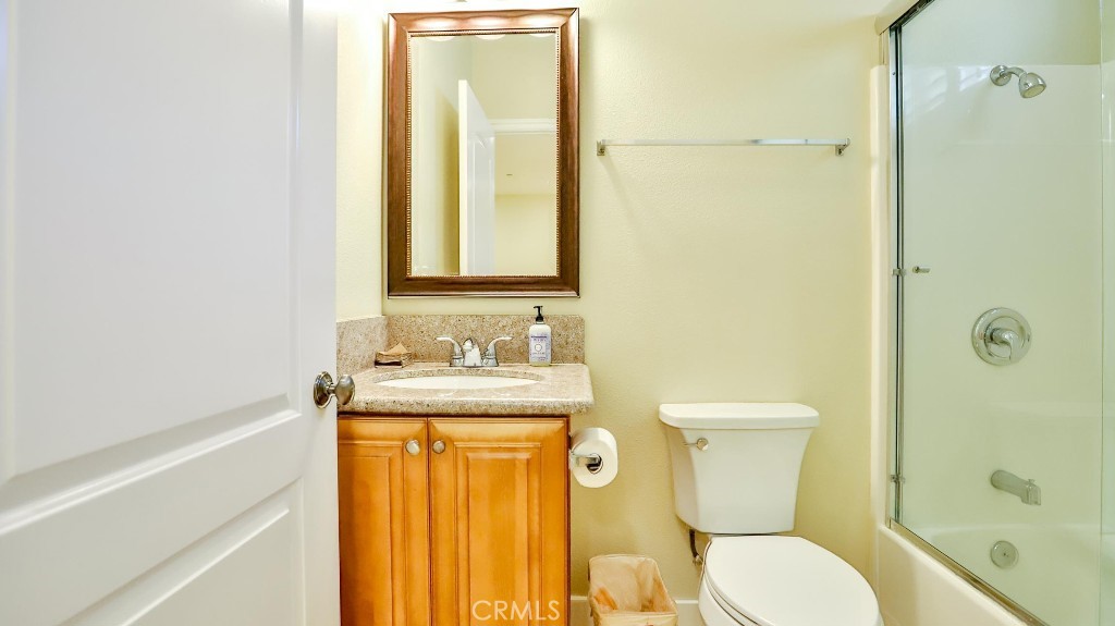 12388 Arrowhead Street Stanton, CA 90680 - Photo 24 of 69 a bathroom with a granite countertop sink toilet and shower