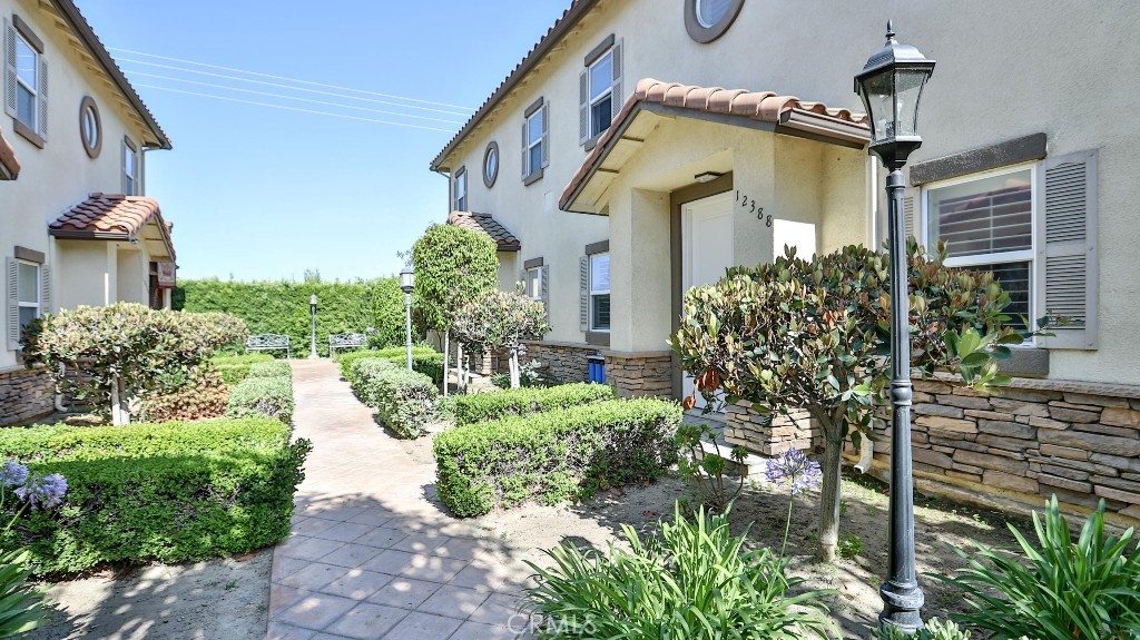 12388 Arrowhead Street Stanton, CA 90680 - Photo 5 of 69 a front view of a house with garden
