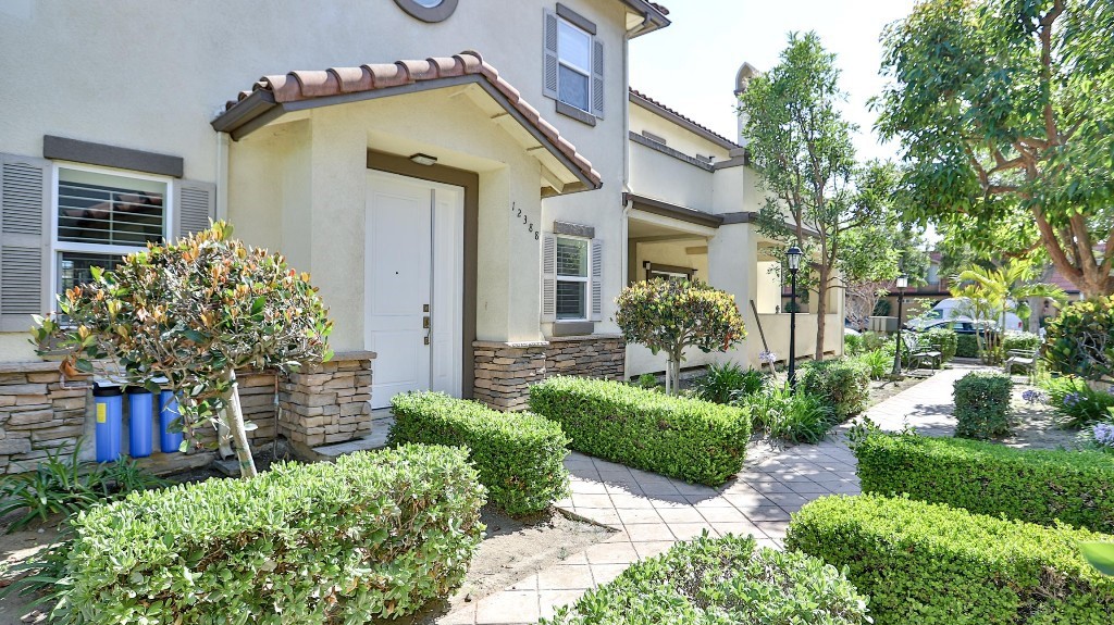 12388 Arrowhead Street Stanton, CA 90680 - Photo 6 of 69 a front view of a house with garden
