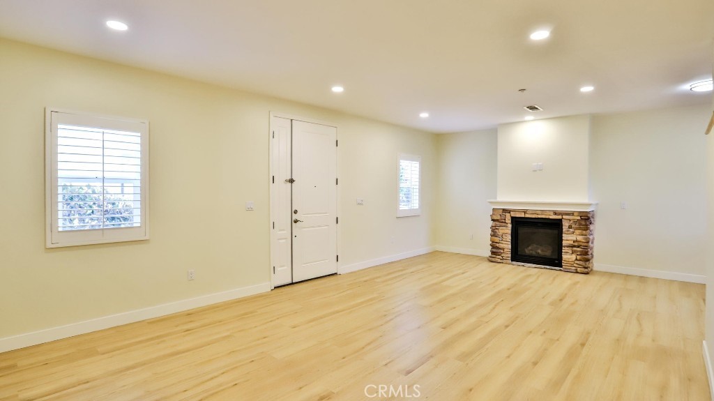 12388 Arrowhead Street Stanton, CA 90680 - Photo 8 of 69 a view of an empty room with a fireplace