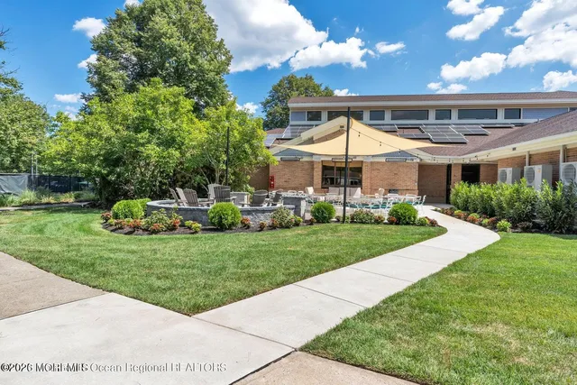 a view of a park with large trees