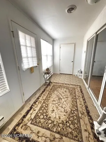 a view of an empty room and window