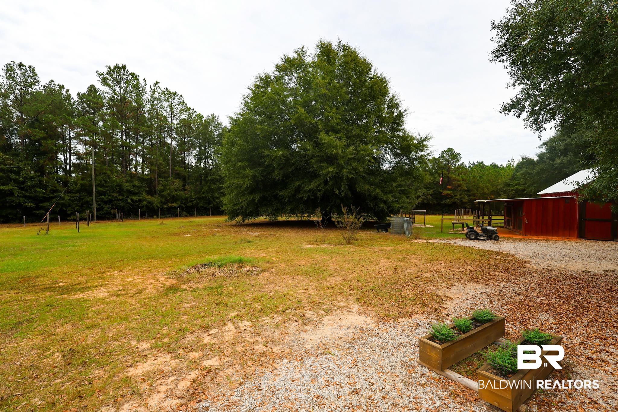 588 A D Clark Road Castleberry, AL 36432 - Photo 14 of 17 View of grassy yard featuring an outdoor structure