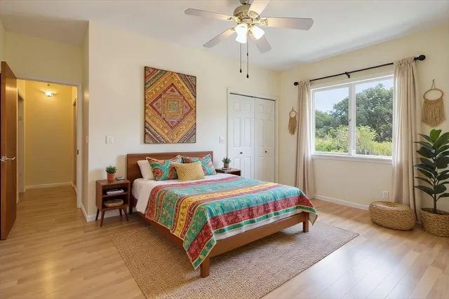 a bedroom with a bed and a window