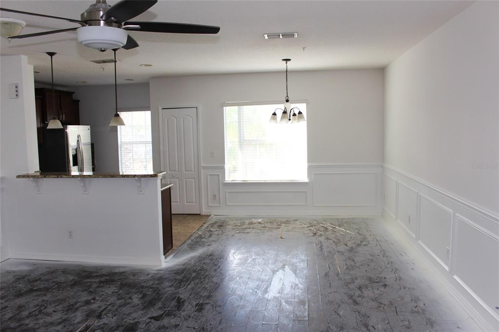 455 Old Farm Lane Winter Springs, FL 32708 - Photo 11 of 38 an empty room with wooden floor and windows