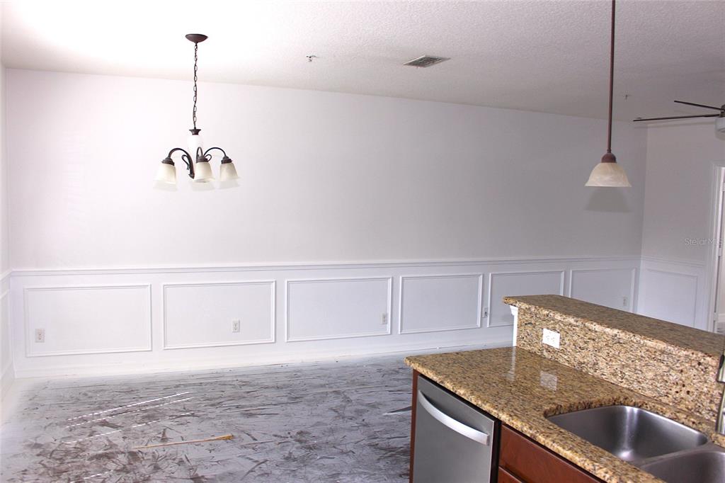 455 Old Farm Lane Winter Springs, FL 32708 - Photo 28 of 38 a kitchen with kitchen island a stove and a sink