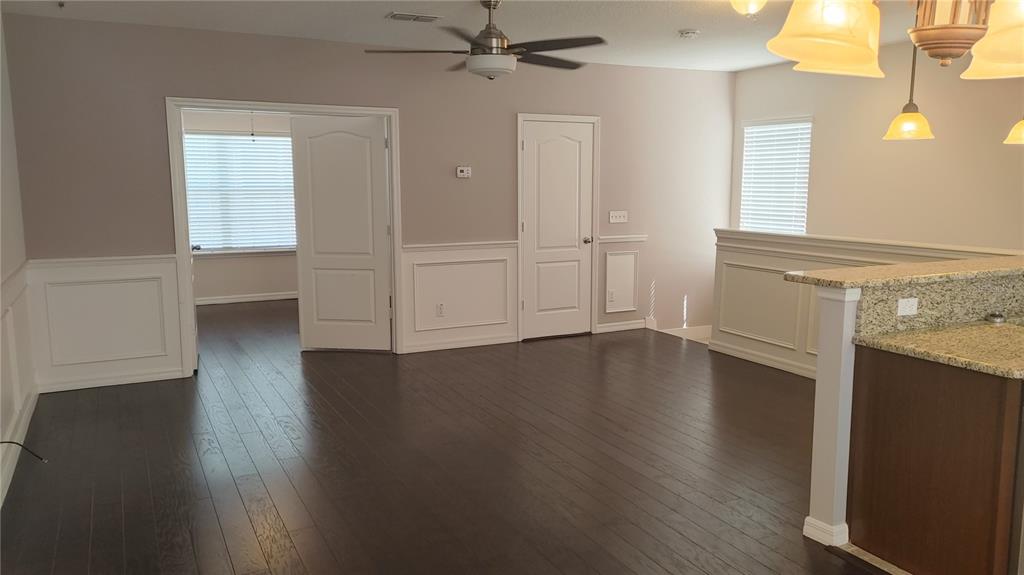 455 Old Farm Lane Winter Springs, FL 32708 - Photo 10 of 38 an empty room with wooden floor and windows