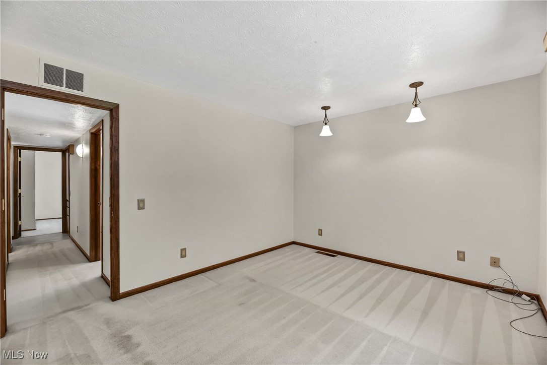 5076 North Barton Road North Ridgeville, OH 44039 - Photo 30 of 41 Carpeted bedroom featuring a textured ceiling