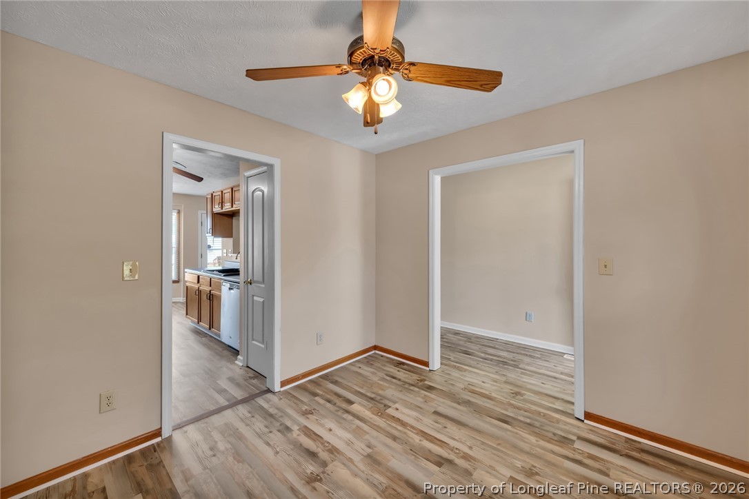 5262 Marvin Drive Spring Lake, NC 28390 - Photo 16 of 23 a view of a livingroom with a chandelier fan and wooden floor