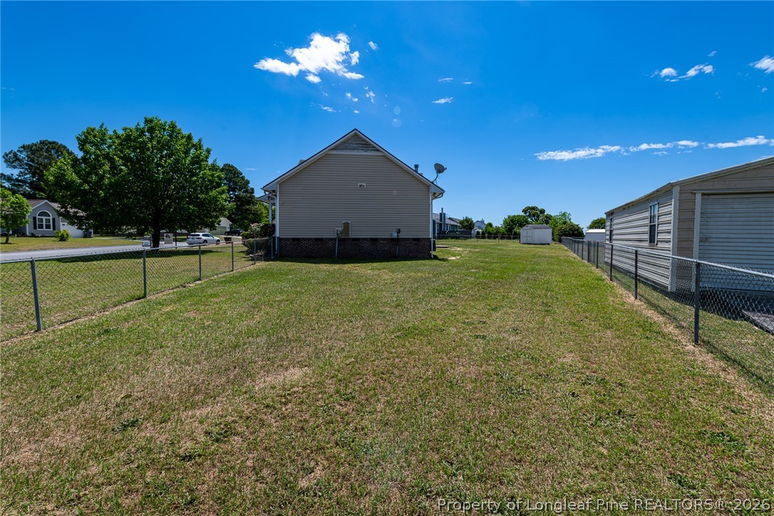 5262 Marvin Drive Spring Lake, NC 28390 - Photo 20 of 23 a view of a yard with a house