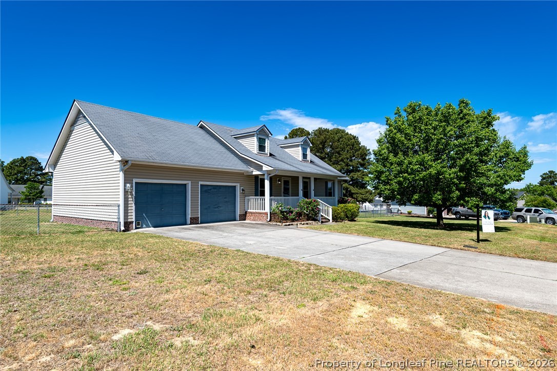 5262 Marvin Drive Spring Lake, NC 28390 - Photo 22 of 23 a front view of a house with a yard