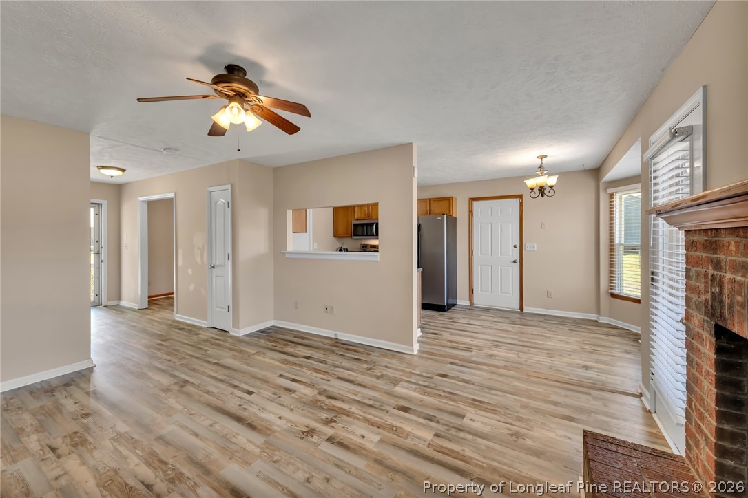 5262 Marvin Drive Spring Lake, NC 28390 - Photo 3 of 23 a view of an empty room with window and a kitchen