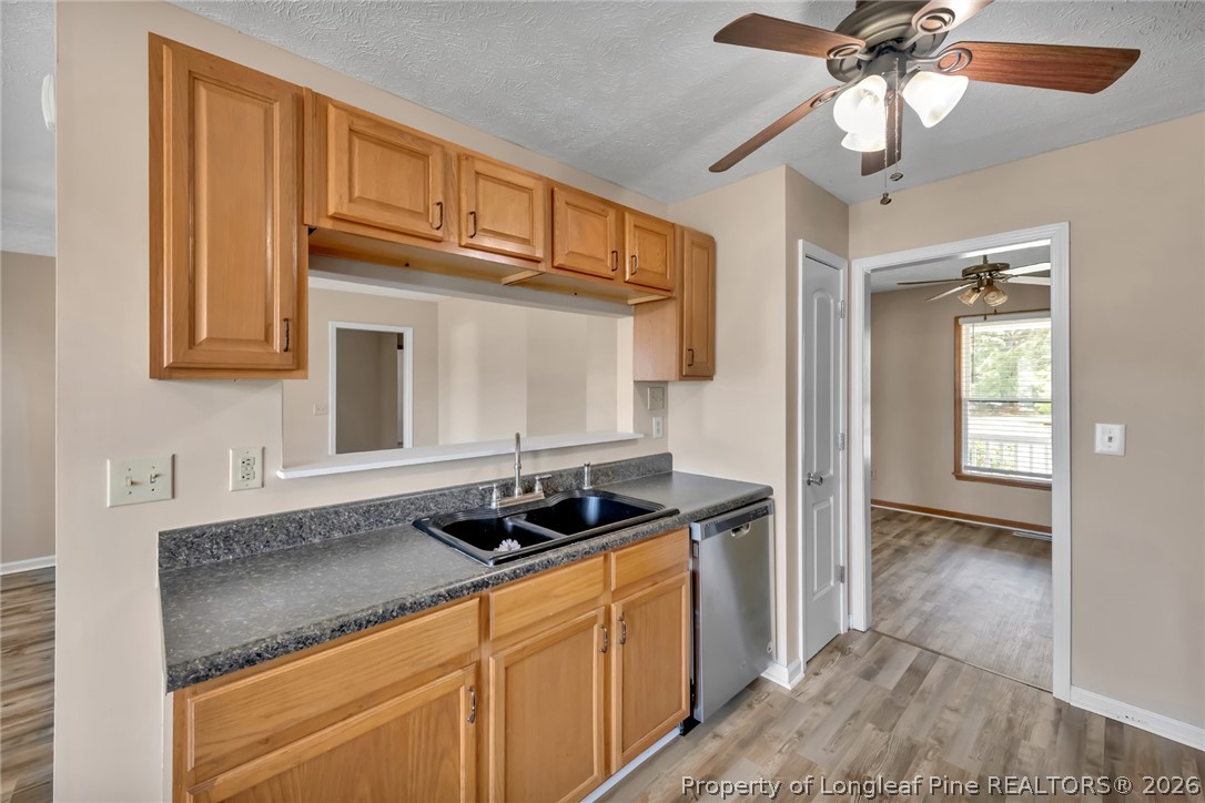 5262 Marvin Drive Spring Lake, NC 28390 - Photo 7 of 23 a kitchen with stainless steel appliances granite countertop a sink and cabinets