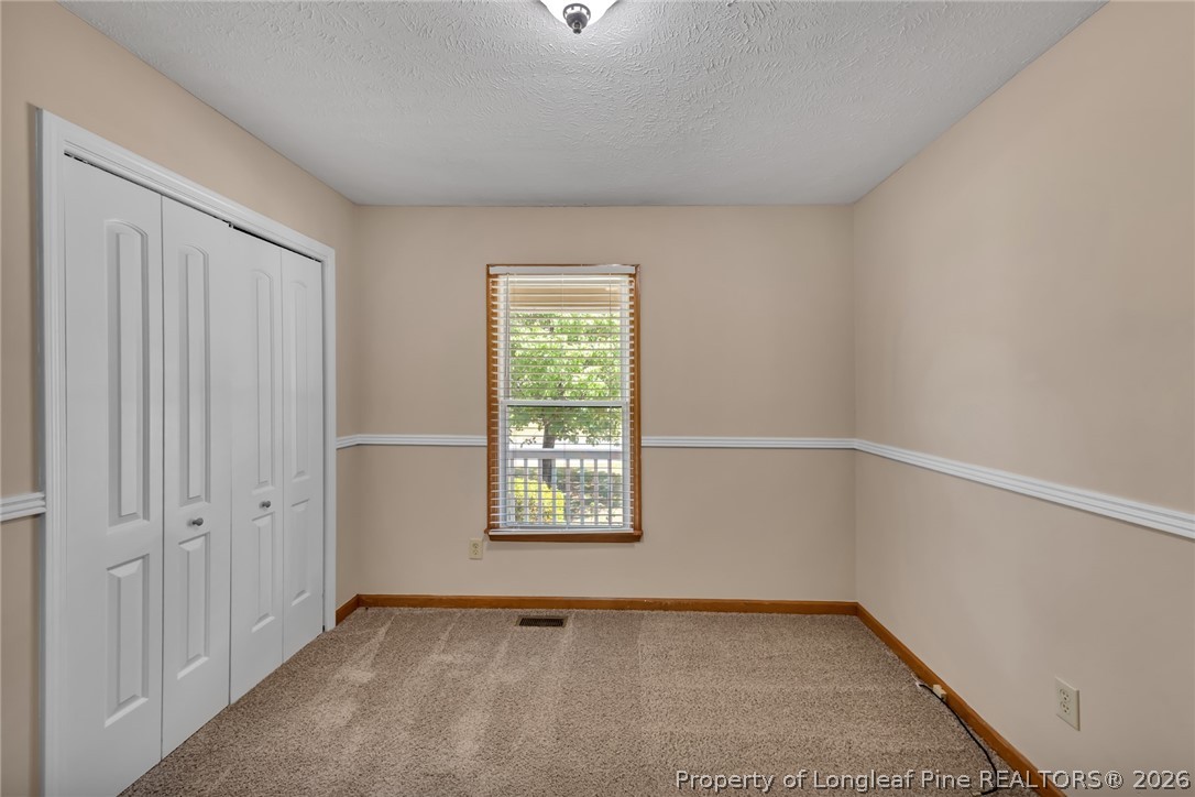 5262 Marvin Drive Spring Lake, NC 28390 - Photo 9 of 23 an empty room with windows