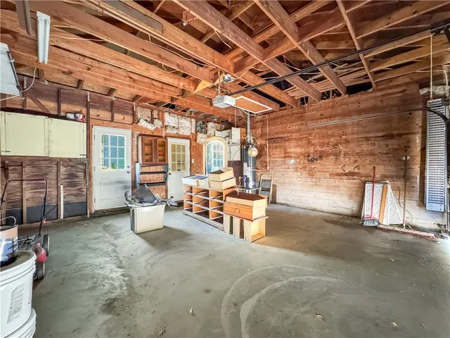 a view of a patio with table and chairs and potted plants
