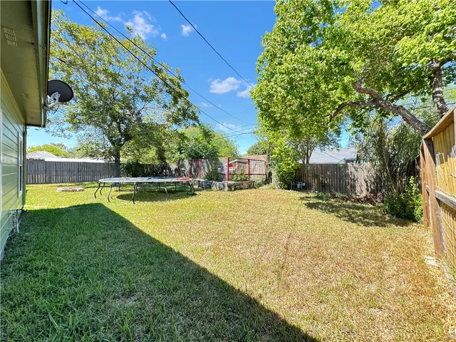a view of swimming pool with a yard