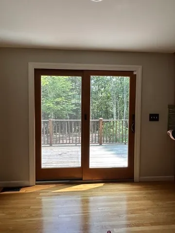 a view of entryway with wooden floor