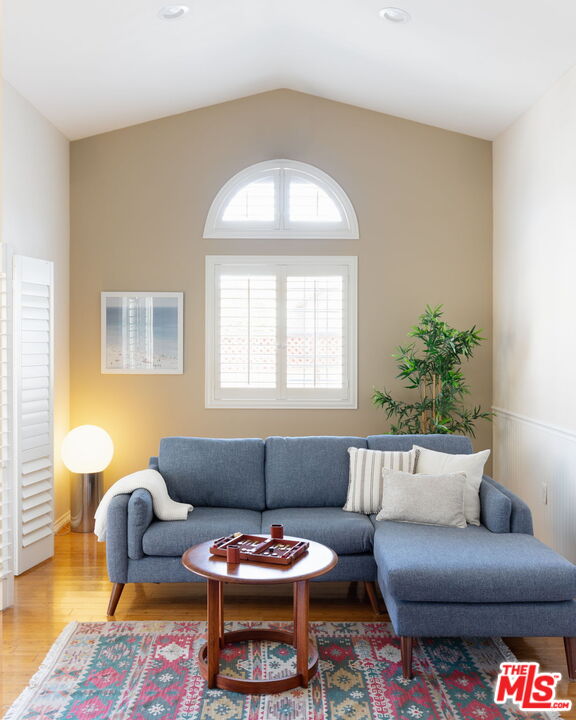 3810 Hauser Boulevard Los Angeles, CA 90008 - Photo 12 of 32 a living room with furniture and a potted plant