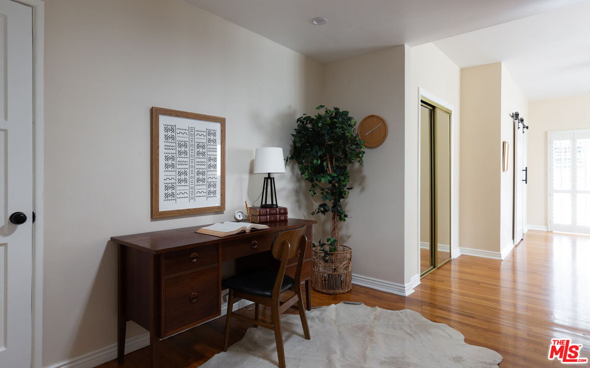3810 Hauser Boulevard Los Angeles, CA 90008 - Photo 14 of 32 a view of a dining room with furniture and wooden floor