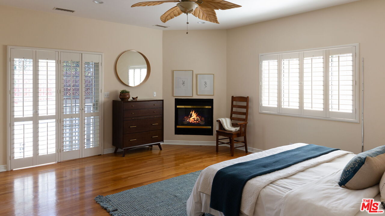 3810 Hauser Boulevard Los Angeles, CA 90008 - Photo 18 of 32 a bedroom with bed and a fireplace