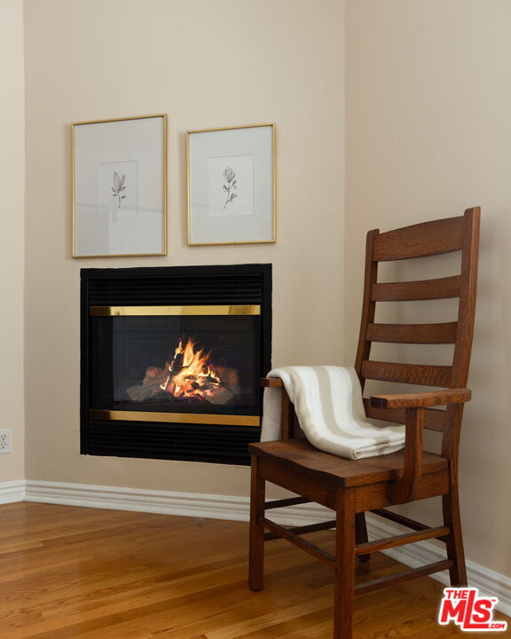 3810 Hauser Boulevard Los Angeles, CA 90008 - Photo 19 of 32 a living room with furniture a fireplace and a flat screen tv