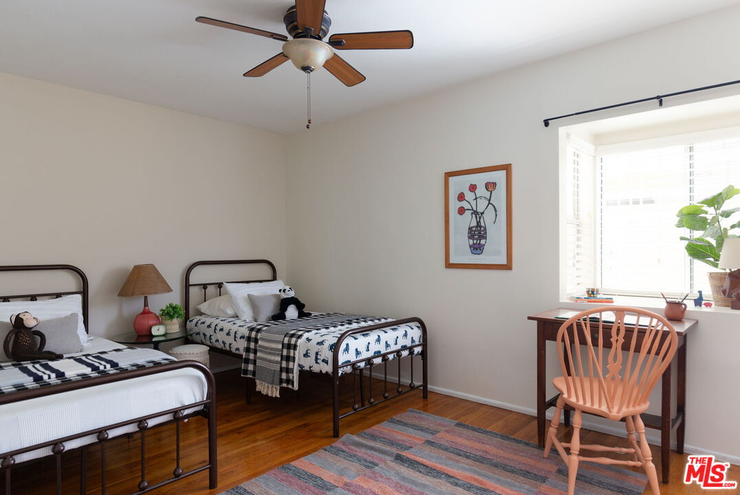 3810 Hauser Boulevard Los Angeles, CA 90008 - Photo 23 of 32 a bedroom with furniture and a window