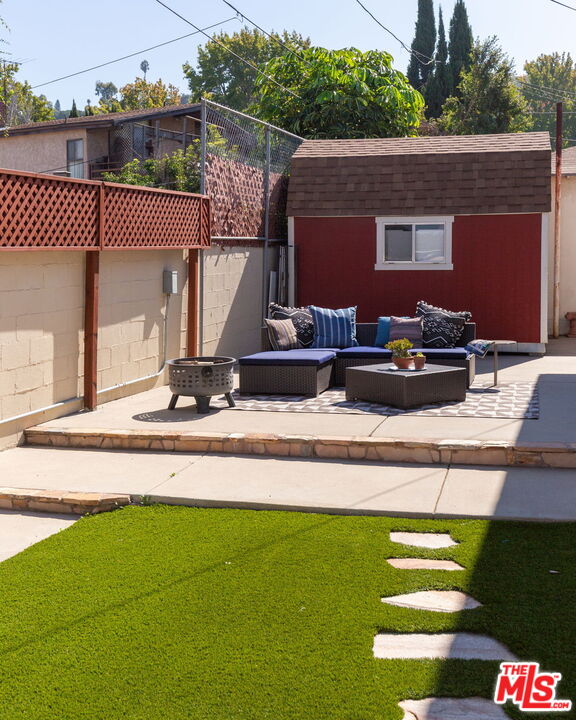 3810 Hauser Boulevard Los Angeles, CA 90008 - Photo 30 of 32 a view of a house with a backyard and a patio