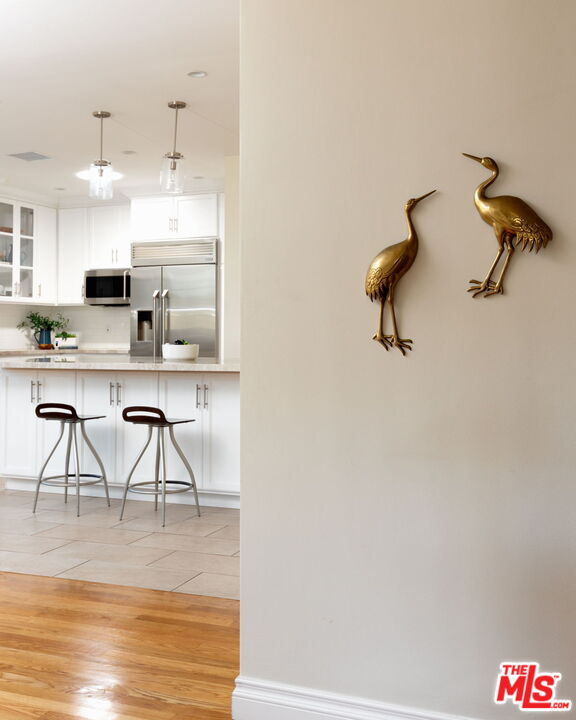 3810 Hauser Boulevard Los Angeles, CA 90008 - Photo 5 of 32 a view of a kitchen with appliances and cabinets