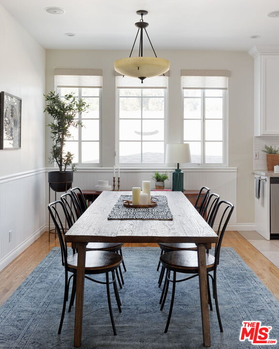 3810 Hauser Boulevard Los Angeles, CA 90008 - Photo 7 of 32 a view of a dining room with furniture window and wooden floor