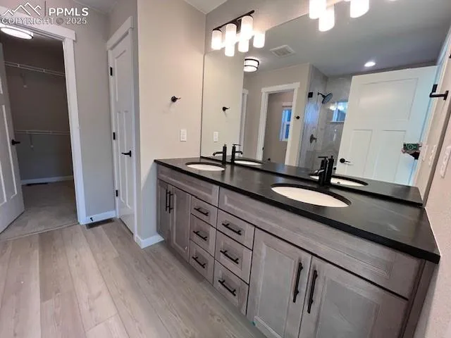 a spacious bathroom with a double vanity sink a and mirror