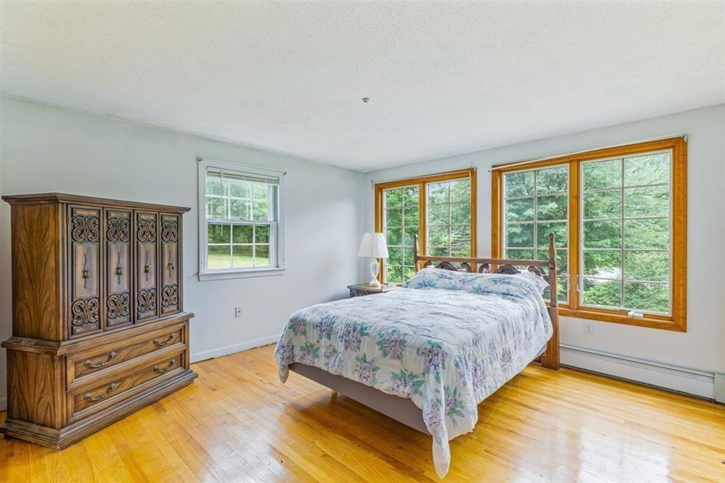 17 Brentwood Road Kingston, MA 02364 - Photo 13 of 33 a bed sitting in a bedroom next to a window